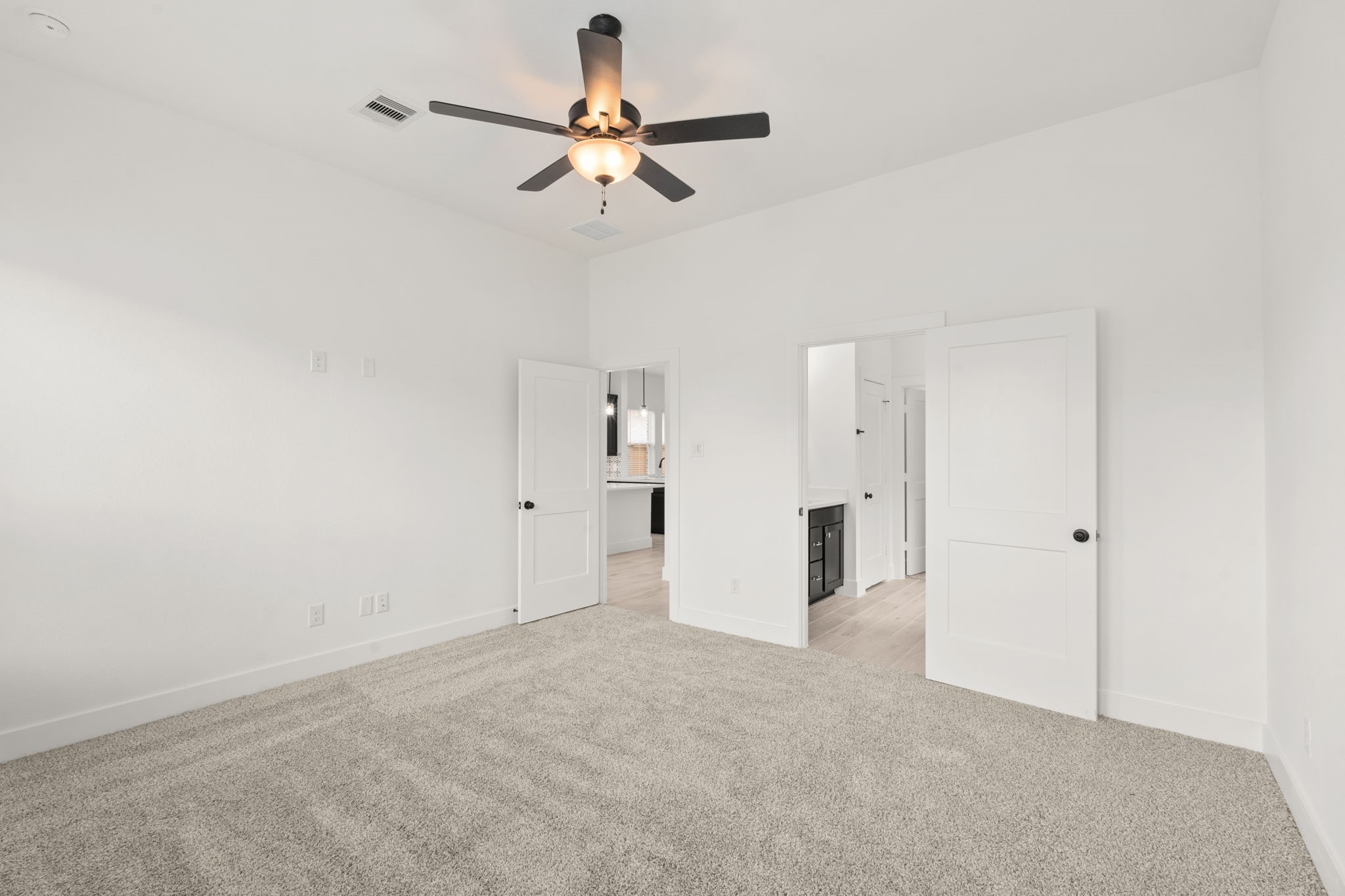 329 Rock Rose Path Willis, TX 77318 - Photo 14 of 36 an empty room with closet and a ceiling fan