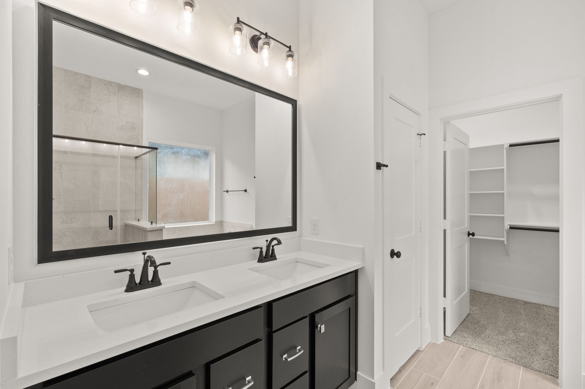 329 Rock Rose Path Willis, TX 77318 - Photo 15 of 36 a bathroom with a sink double vanity and a mirror