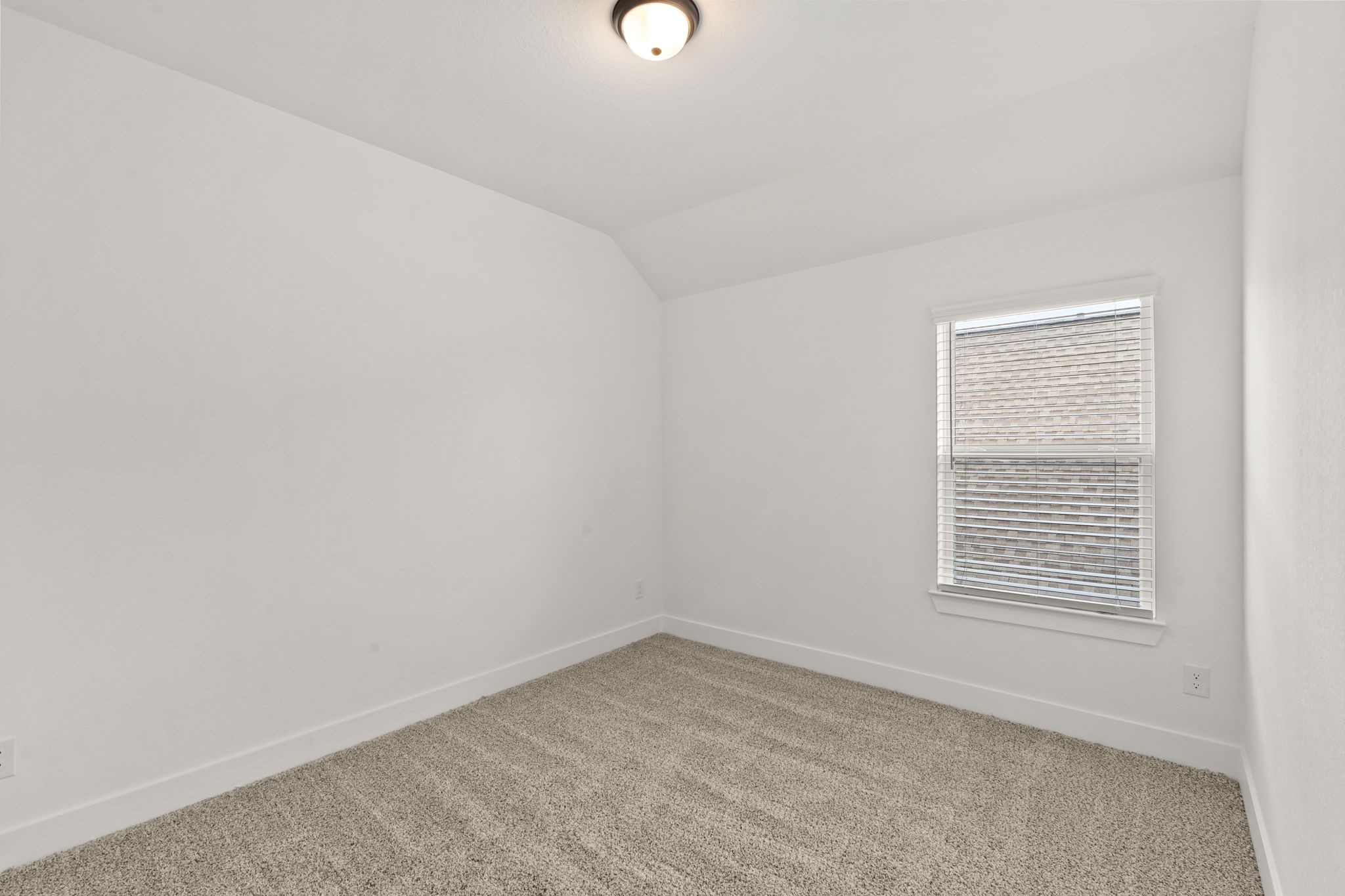 329 Rock Rose Path Willis, TX 77318 - Photo 22 of 36 a view of an empty room with a window