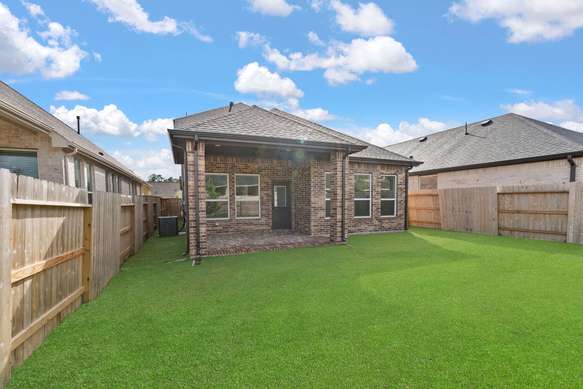 329 Rock Rose Path Willis, TX 77318 - Photo 28 of 36 a view of a house with a yard and sitting area