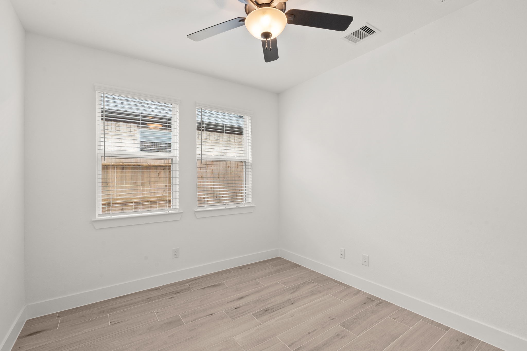 329 Rock Rose Path Willis, TX 77318 - Photo 9 of 36 an empty room with a window