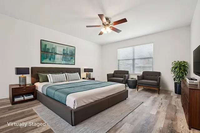 a bedroom with bed and a window