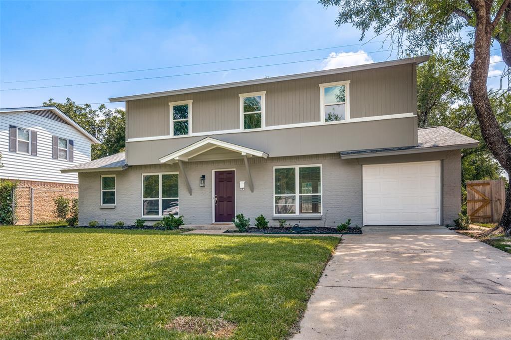 1202 Quill Drive Plano, TX 75075 - Photo 2 of 28 a front view of house with yard and green space