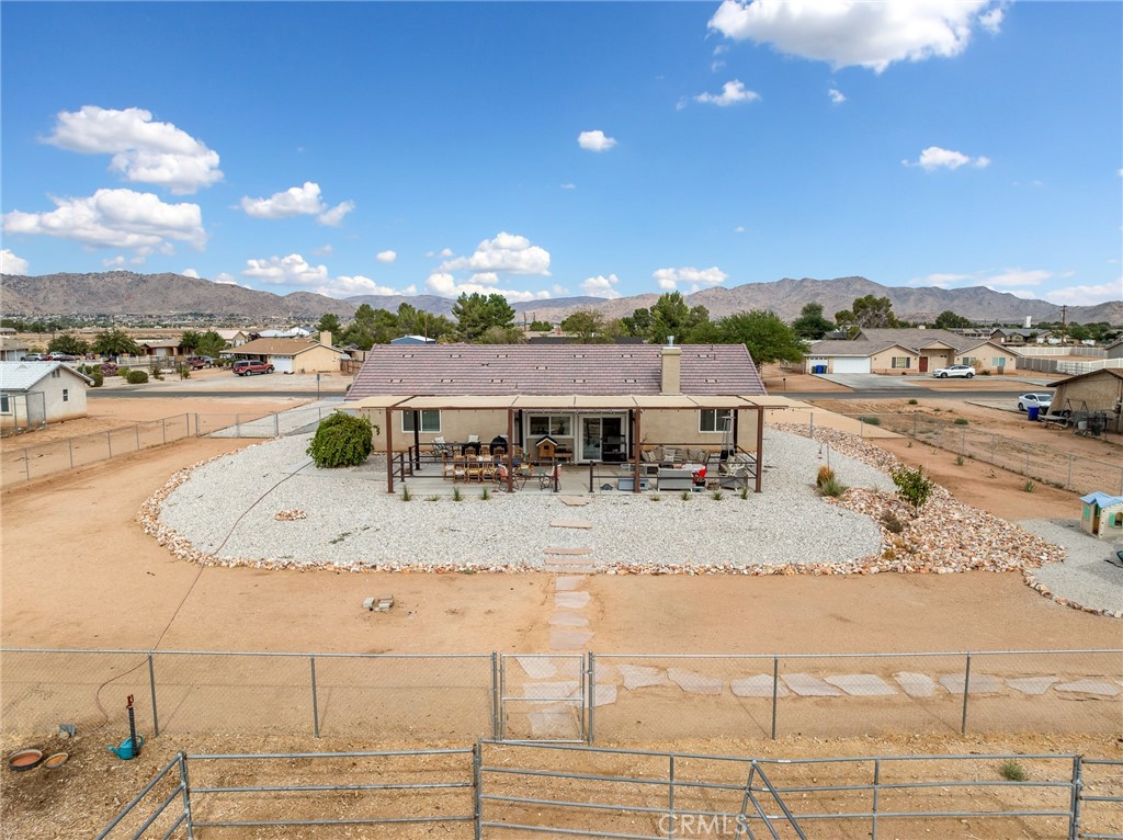 15620 Erie Road Apple Valley, CA 92307 - Photo 4 of 53 a view of a swimming pool with a lounge chair