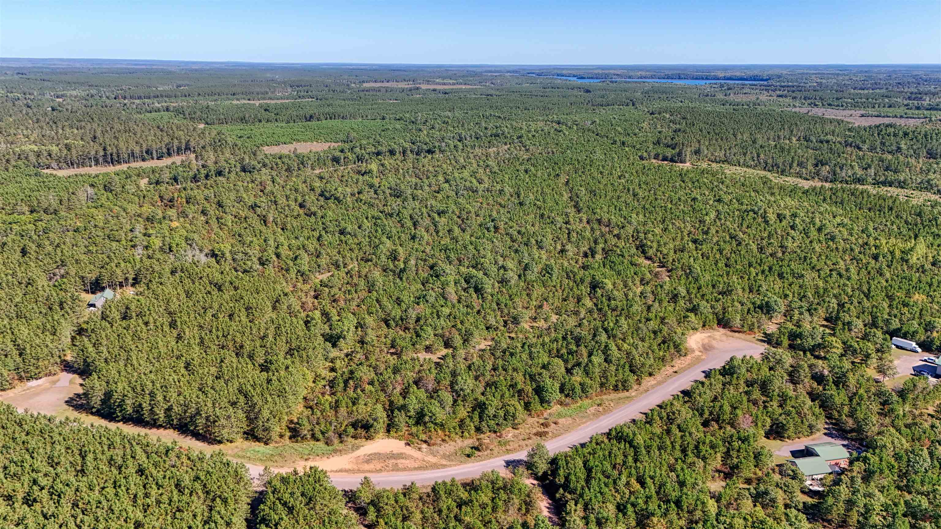 Lot 18 Cove Lane Gordon, WI 54838 - Photo 20 of 25 Aerial view of property's location featuring a heavily wooded area