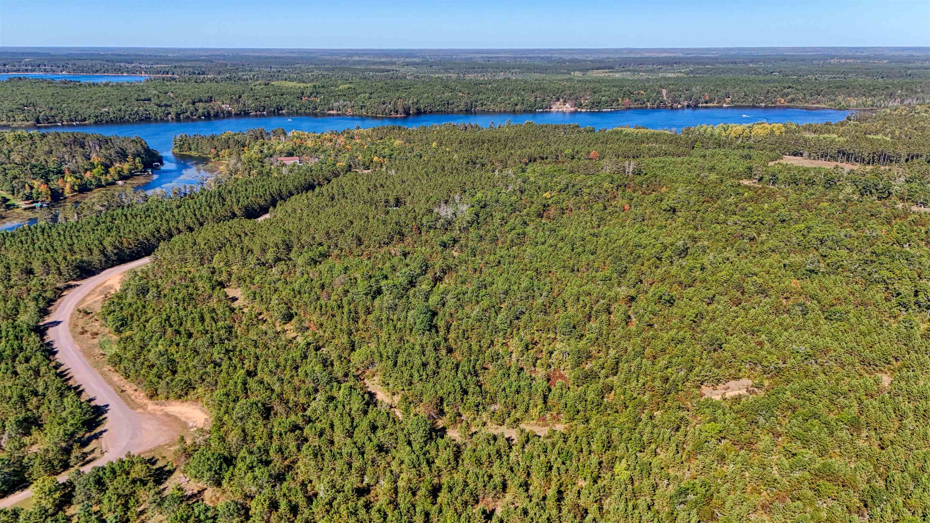 Lot 18 Cove Lane Gordon, WI 54838 - Photo 2 of 25 Bird's eye view of a forest and a large body of water