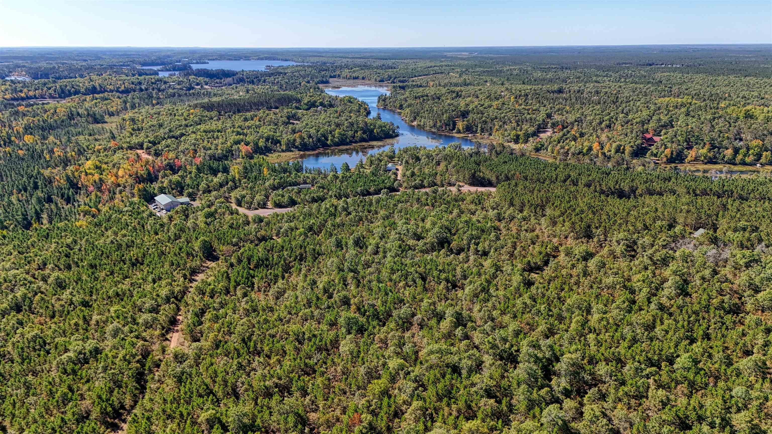 Lot 18 Cove Lane Gordon, WI 54838 - Photo 23 of 25 Aerial view of a heavily wooded area and a large body of water