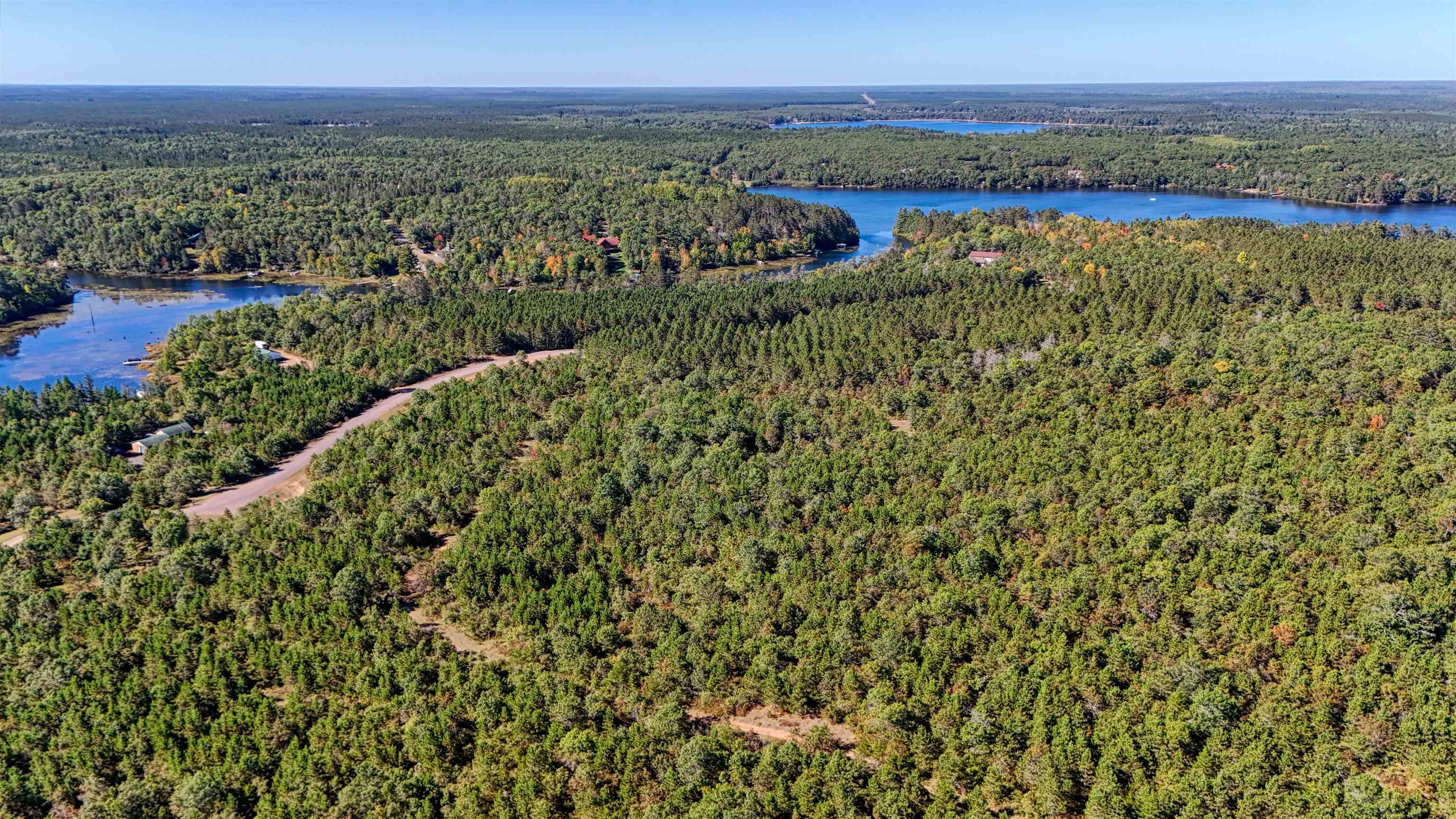 Lot 18 Cove Lane Gordon, WI 54838 - Photo 24 of 25 Aerial overview of property's location with a forest and a large body of water