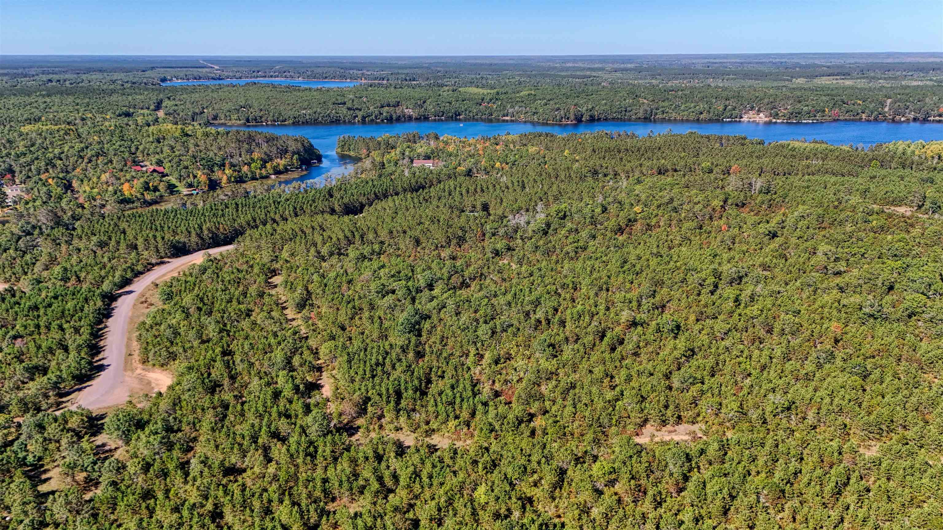Lot 18 Cove Lane Gordon, WI 54838 - Photo 25 of 25 Aerial view of a forest and a large body of water