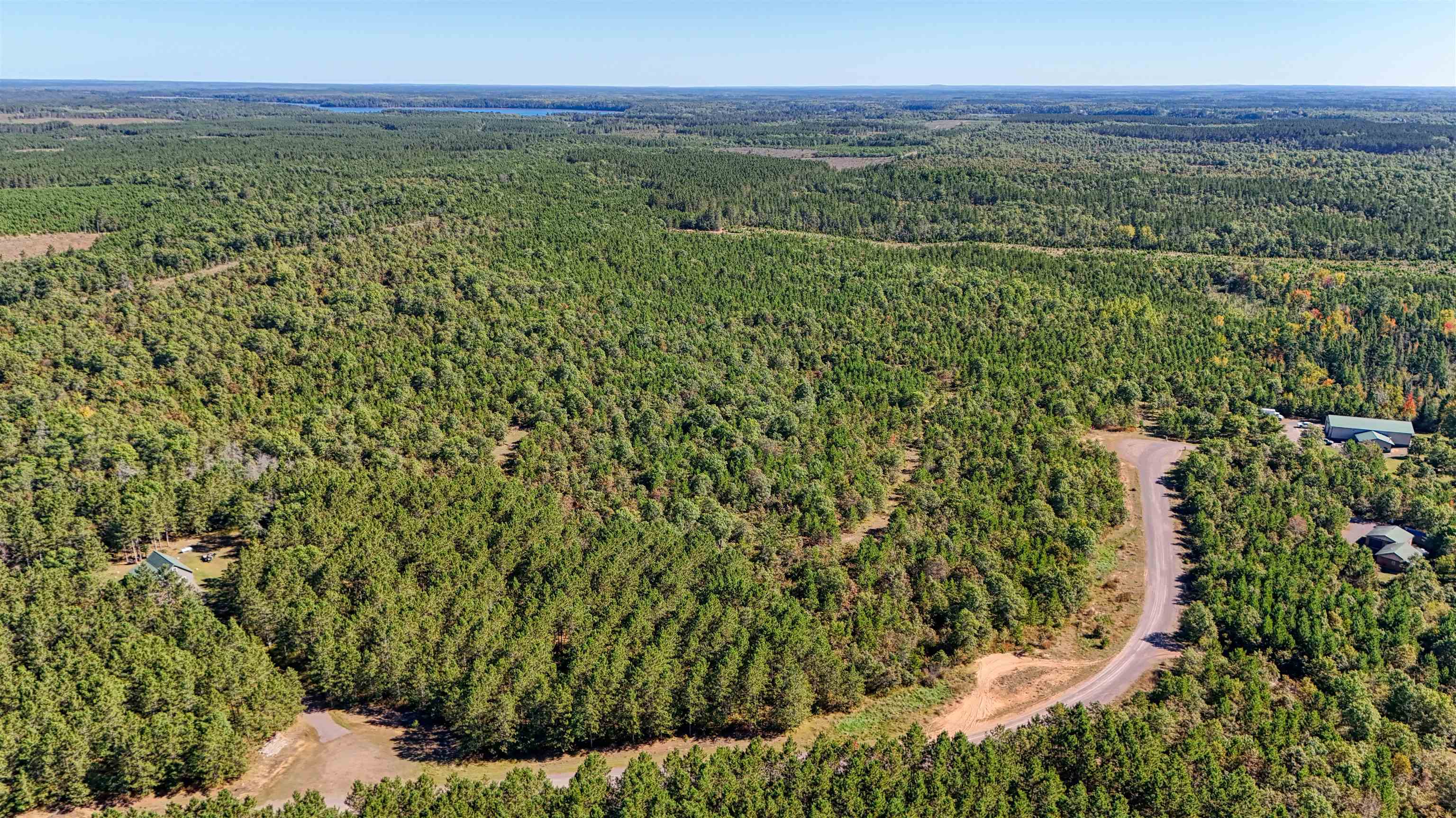 Lot 18 Cove Lane Gordon, WI 54838 - Photo 4 of 25 Aerial view of property and surrounding area with a forest
