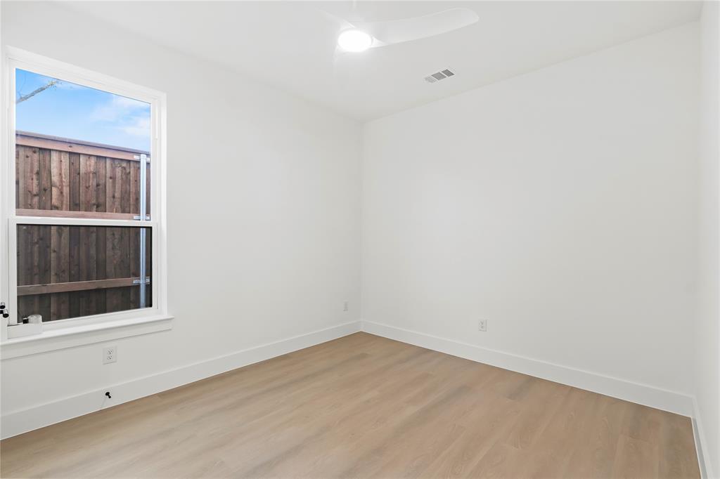459 Hart Street Dallas, TX 75203 - Photo 11 of 21 Spare room with wood finished floors and a ceiling fan