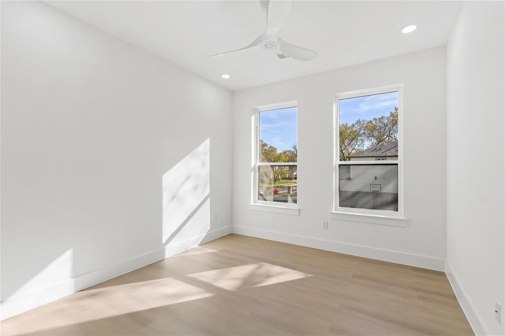 459 Hart Street Dallas, TX 75203 - Photo 13 of 21 Spare room with light wood finished floors, ceiling fan, and recessed lighting