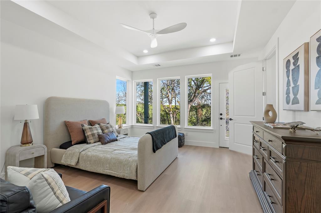 459 Hart Street Dallas, TX 75203 - Photo 14 of 21 Bedroom featuring ceiling fan, access to outside, light wood-style floors, recessed lighting, and a raised ceiling
