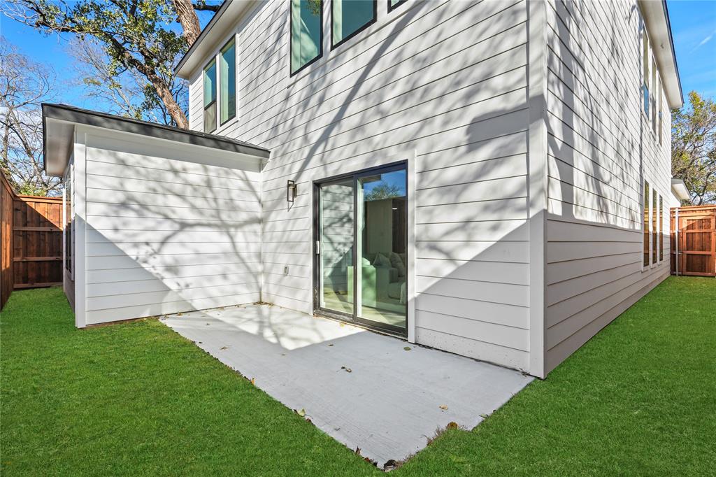 459 Hart Street Dallas, TX 75203 - Photo 20 of 21 Rear view of house featuring a fenced backyard and a patio