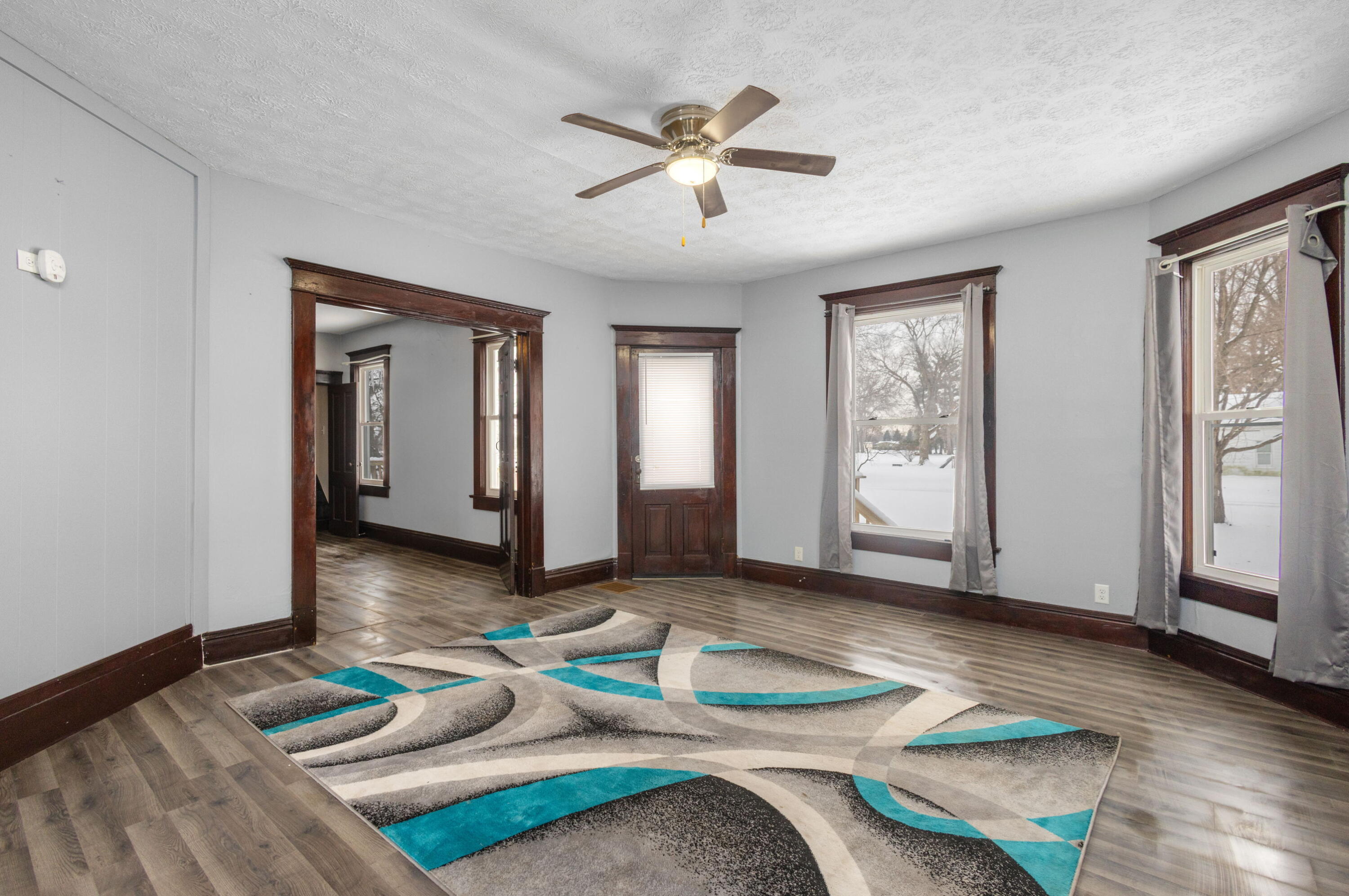 203 North Main Street Kingsbury, IN 46350 - Photo 2 of 32 a living room with furniture and a window