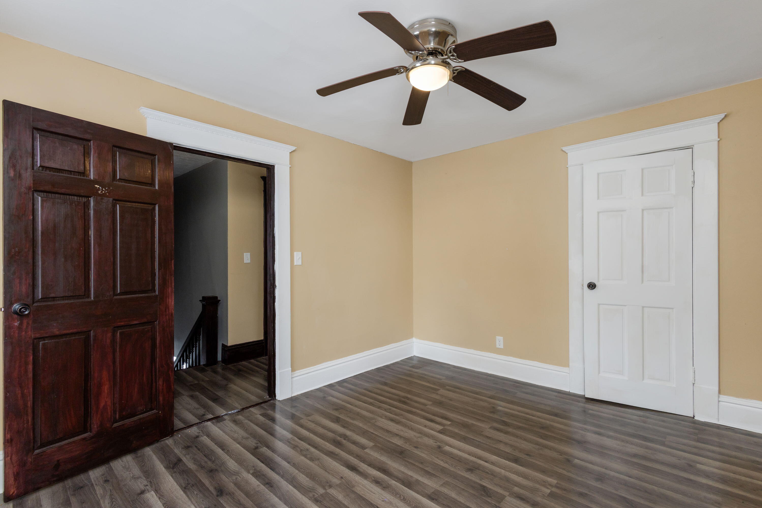 203 North Main Street Kingsbury, IN 46350 - Photo 21 of 32 an empty room with wooden floor closet and windows