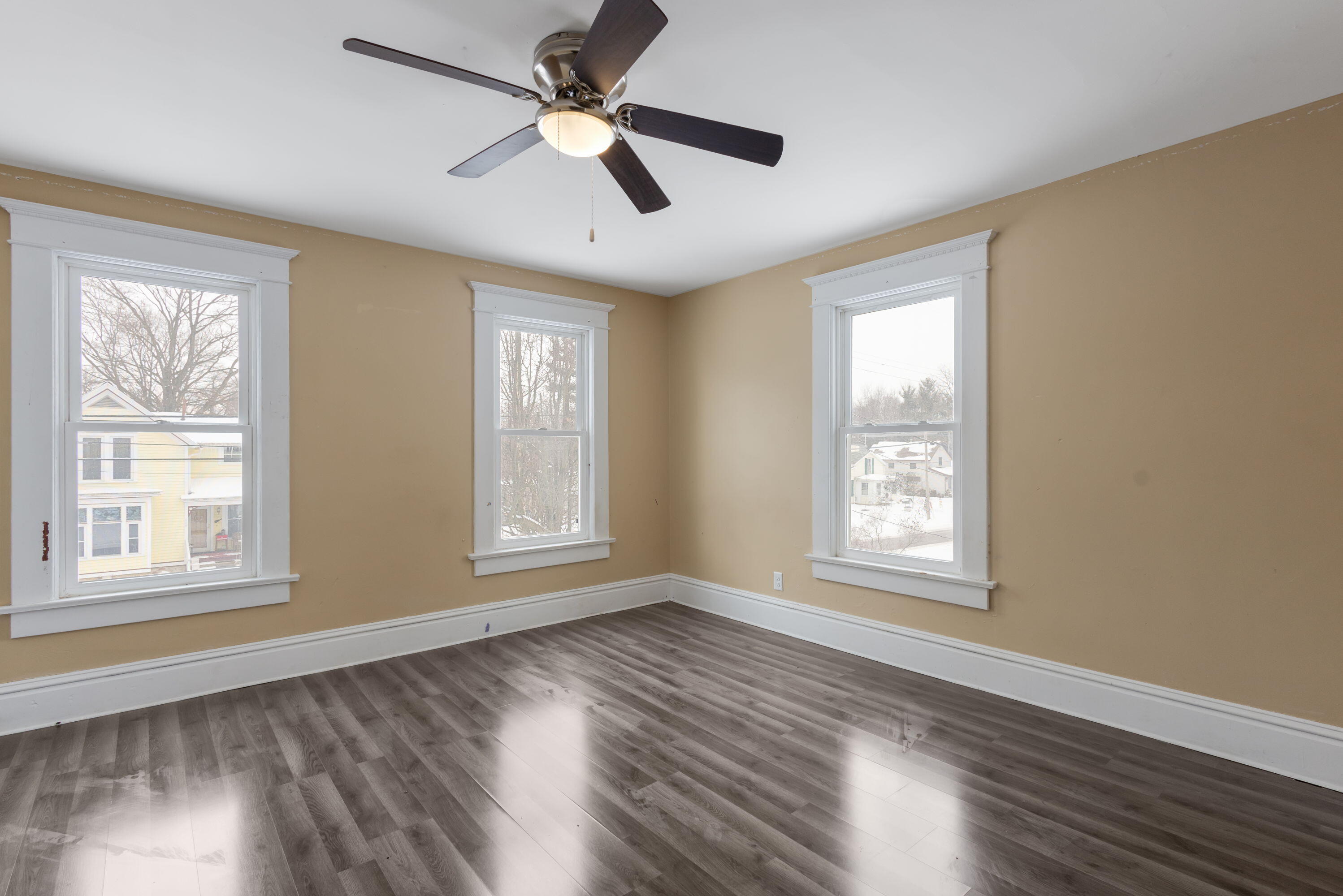 203 North Main Street Kingsbury, IN 46350 - Photo 23 of 32 a view of an empty room with wooden floor and a window