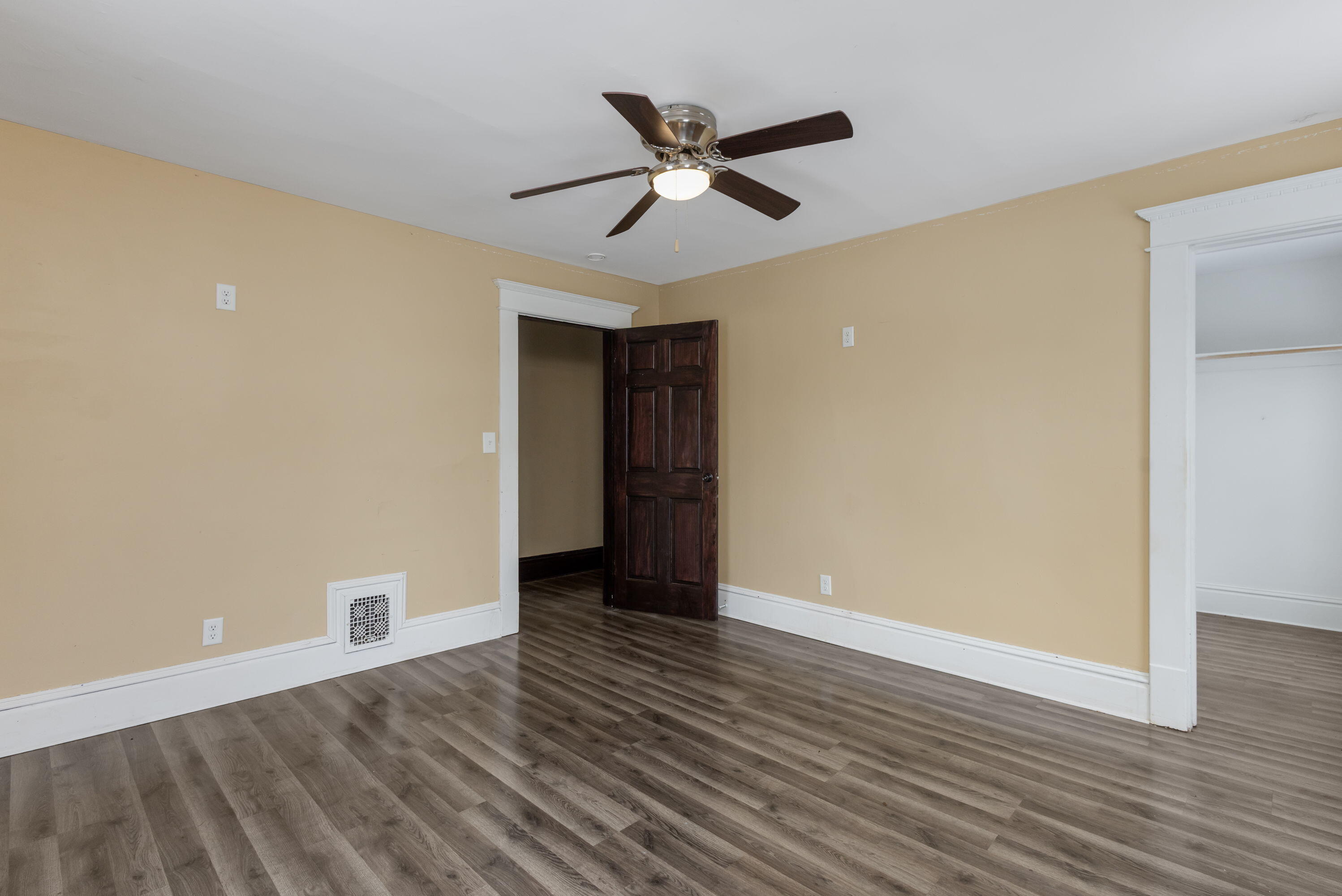 203 North Main Street Kingsbury, IN 46350 - Photo 25 of 32 a view of an empty room with wooden floor and a ceiling fan