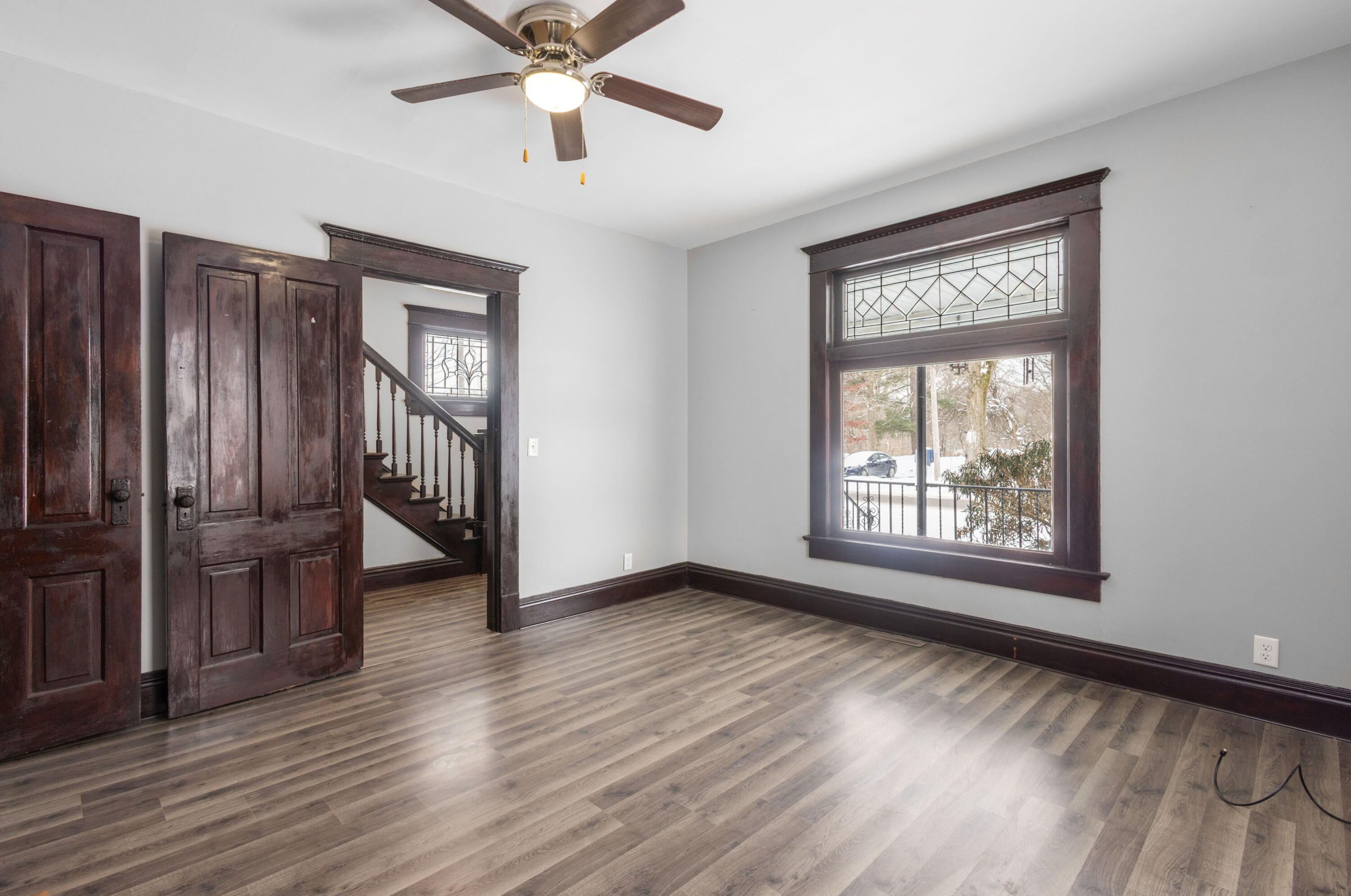 203 North Main Street Kingsbury, IN 46350 - Photo 3 of 32 a view of an empty room with wooden floor and a window