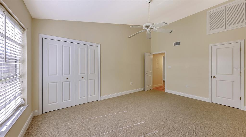5860 Midnight Pass Road, Unit 40 Sarasota, FL 34242 - Photo 14 of 37 a view of an empty room with a window