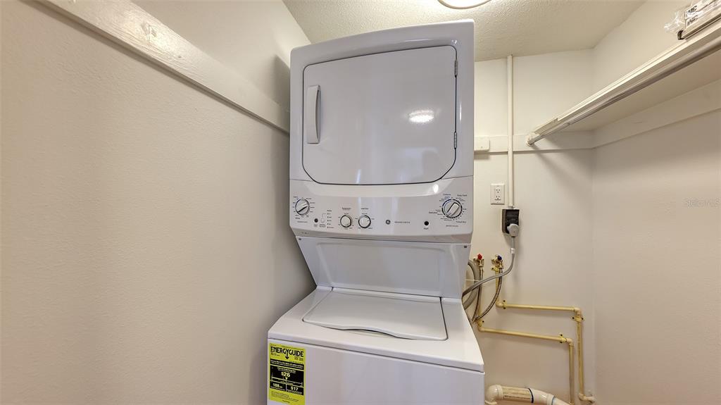 5860 Midnight Pass Road, Unit 40 Sarasota, FL 34242 - Photo 17 of 37 a bathroom with a toilet and a mirror