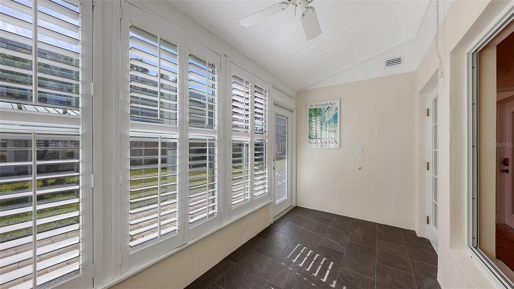 5860 Midnight Pass Road, Unit 40 Sarasota, FL 34242 - Photo 18 of 37 a view of empty room with windows
