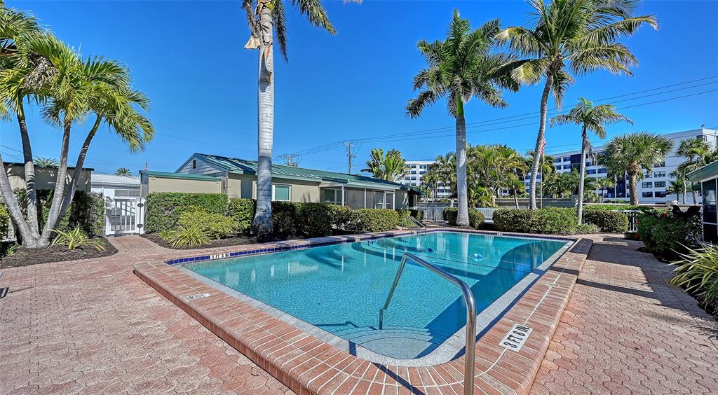 5860 Midnight Pass Road, Unit 40 Sarasota, FL 34242 - Photo 28 of 37 a view of a house with swimming pool