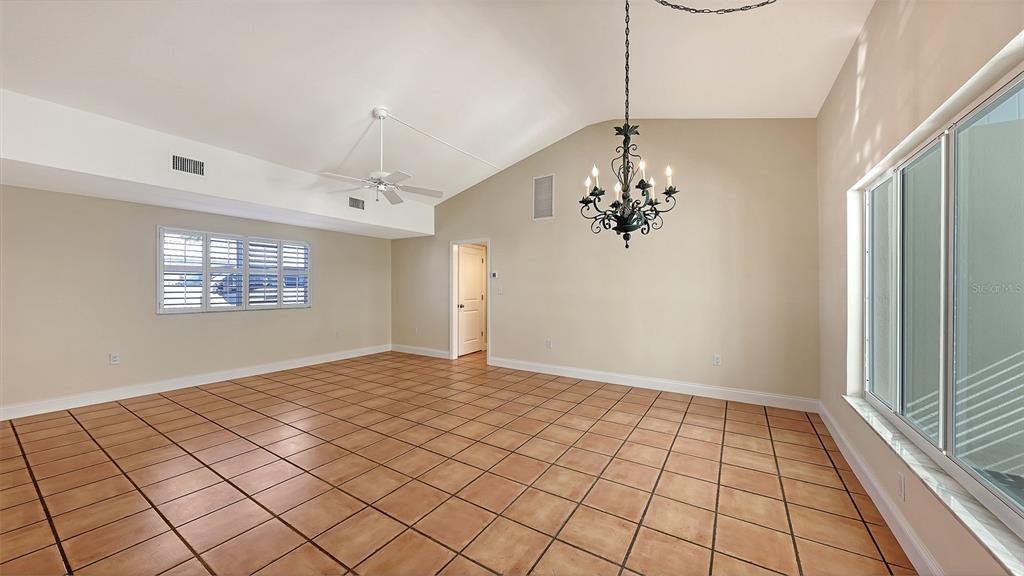 5860 Midnight Pass Road, Unit 40 Sarasota, FL 34242 - Photo 7 of 37 a view of an empty room and window