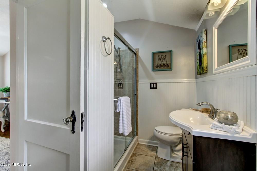 3752 Lilly Road North Jacksonville, FL 32207 - Photo 18 of 28 a bathroom with a sink toilet and shower