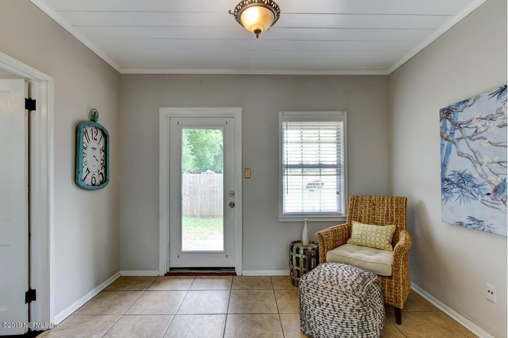 3752 Lilly Road North Jacksonville, FL 32207 - Photo 7 of 28 a living room with furniture and a window