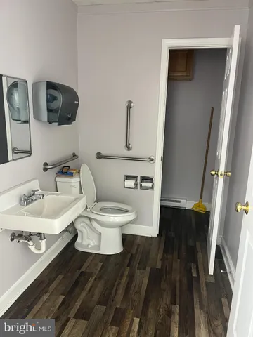a white toilet sitting next to a bathroom sink