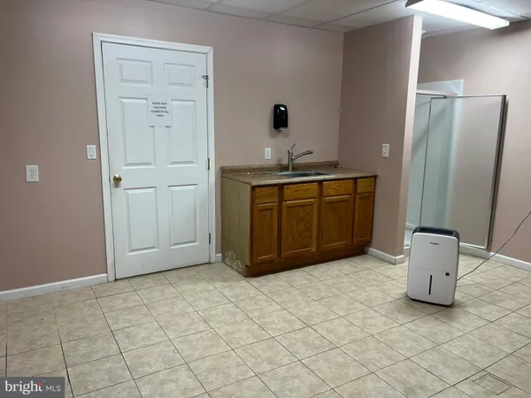a kitchen with stainless steel appliances granite countertop a refrigerator and a stove