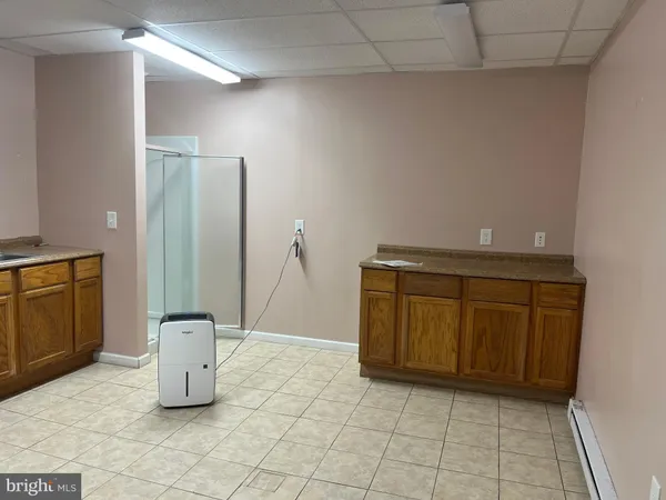 a view of a storage & utility room with two washing machine