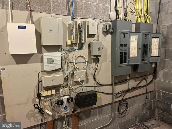 a utility room with multiple dryer and washer