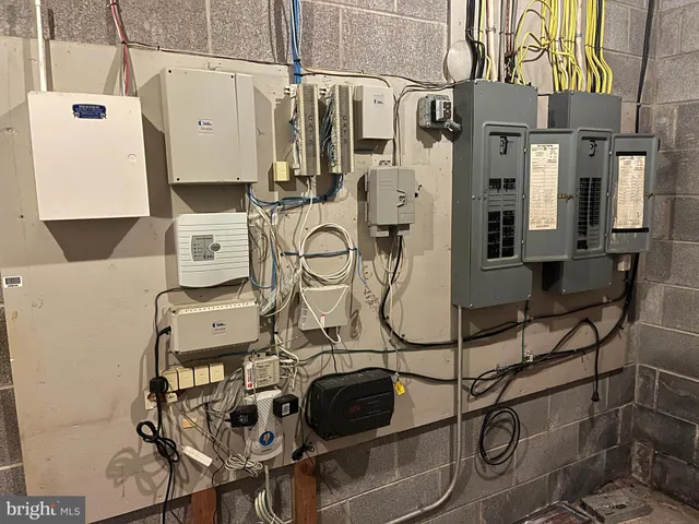 a utility room with multiple dryer and washer