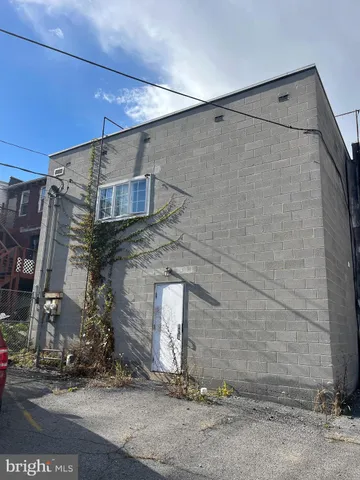 a view of a brick house with a street