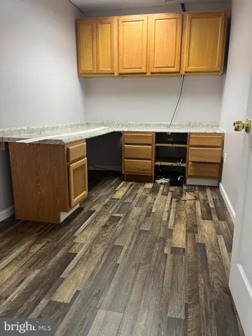 a room with wooden cabinets and a wooden floors