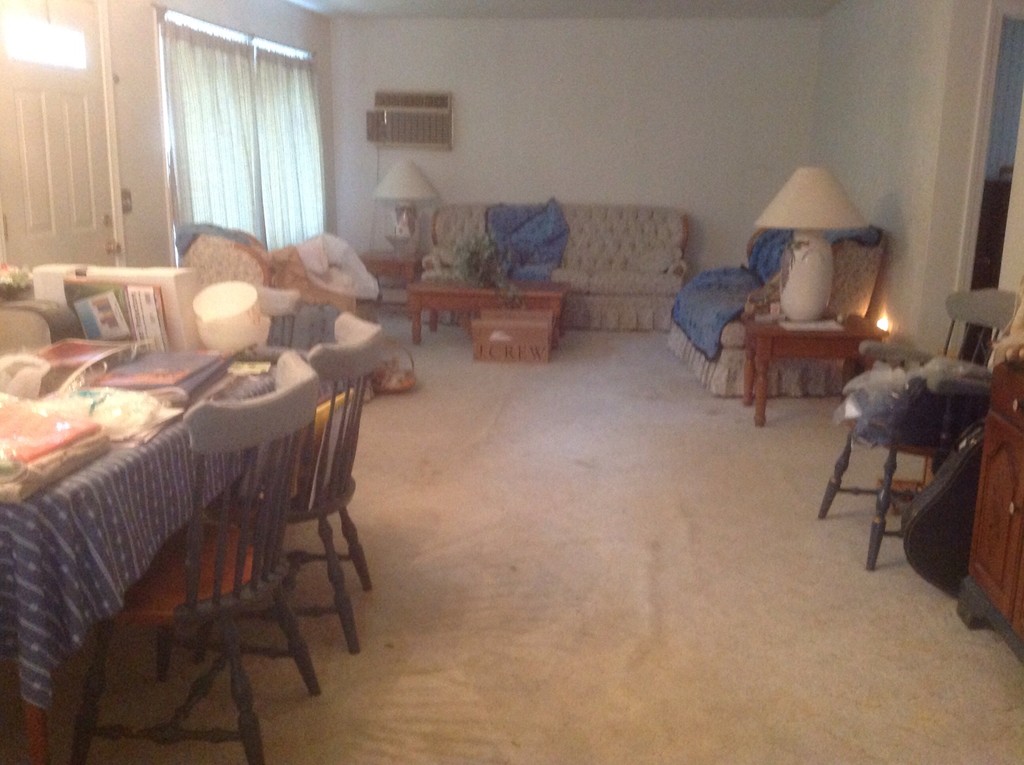 3 Old Village Road Sturbridge, MA 01566 - Photo 2 of 3 a living room with furniture and a lamp