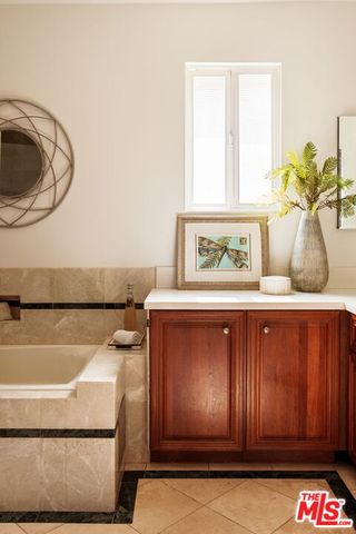 a closeup of a sink with a washer and dryer