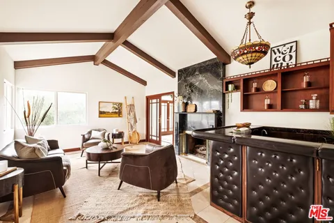 a very nice looking living room with a wooden floor and furniture