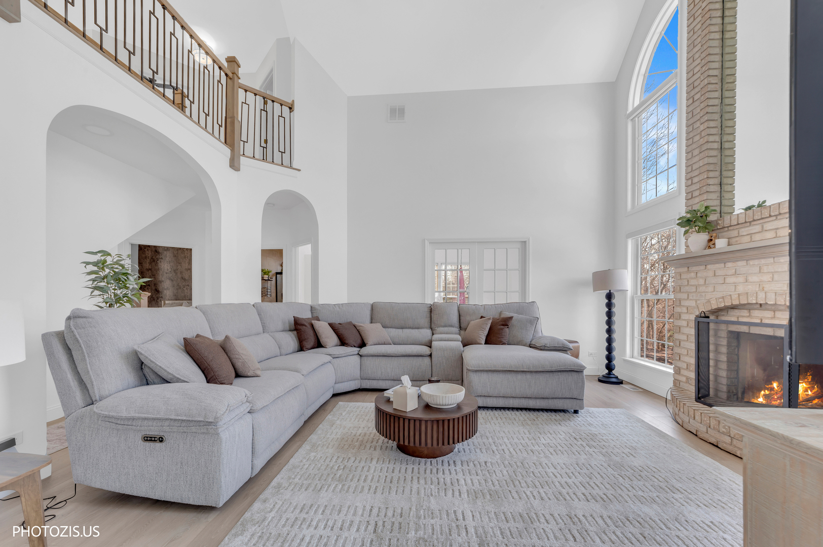 3517 Oakleaf Lane Crystal Lake, IL 60012 - Photo 13 of 76 a living room with furniture a fireplace and a large window