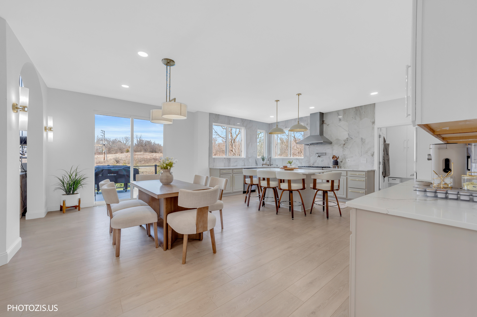 3517 Oakleaf Lane Crystal Lake, IL 60012 - Photo 16 of 76 a dining room with stainless steel appliances kitchen island granite countertop a table and chairs