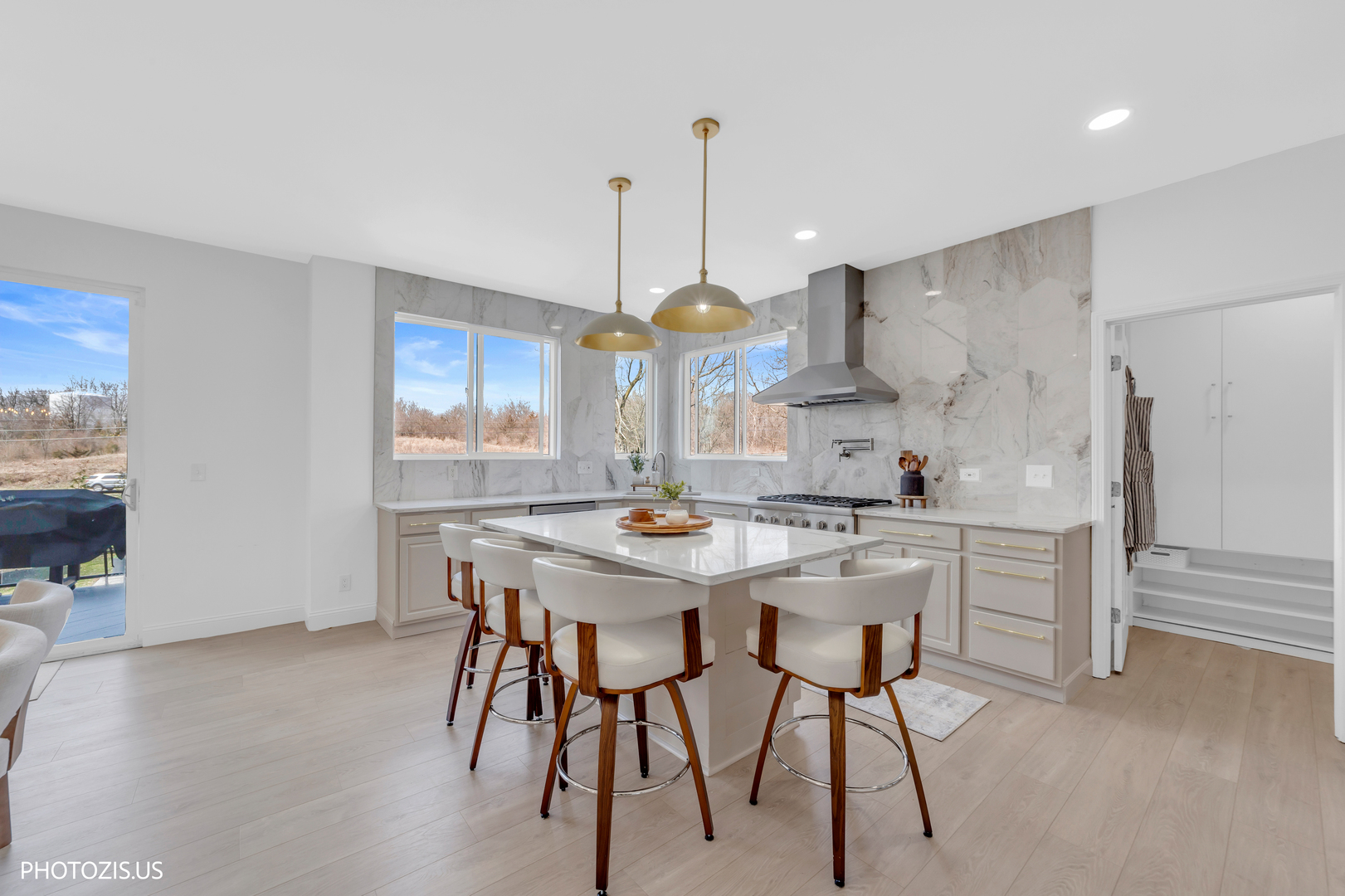 3517 Oakleaf Lane Crystal Lake, IL 60012 - Photo 17 of 76 a kitchen with stainless steel appliances kitchen island a chandelier and white cabinets