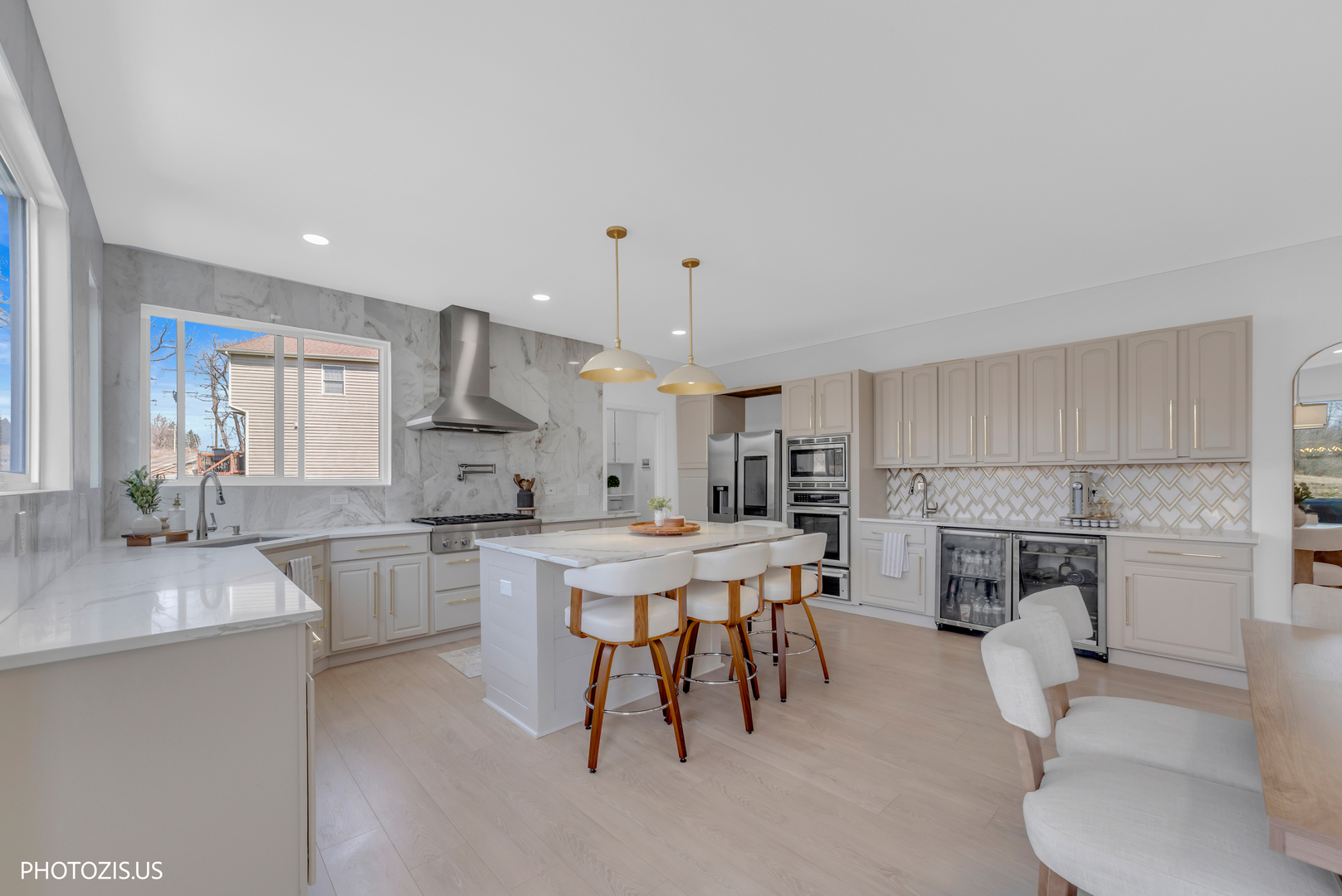 3517 Oakleaf Lane Crystal Lake, IL 60012 - Photo 19 of 76 a large white kitchen with a stove a sink a oven a dining table and chairs