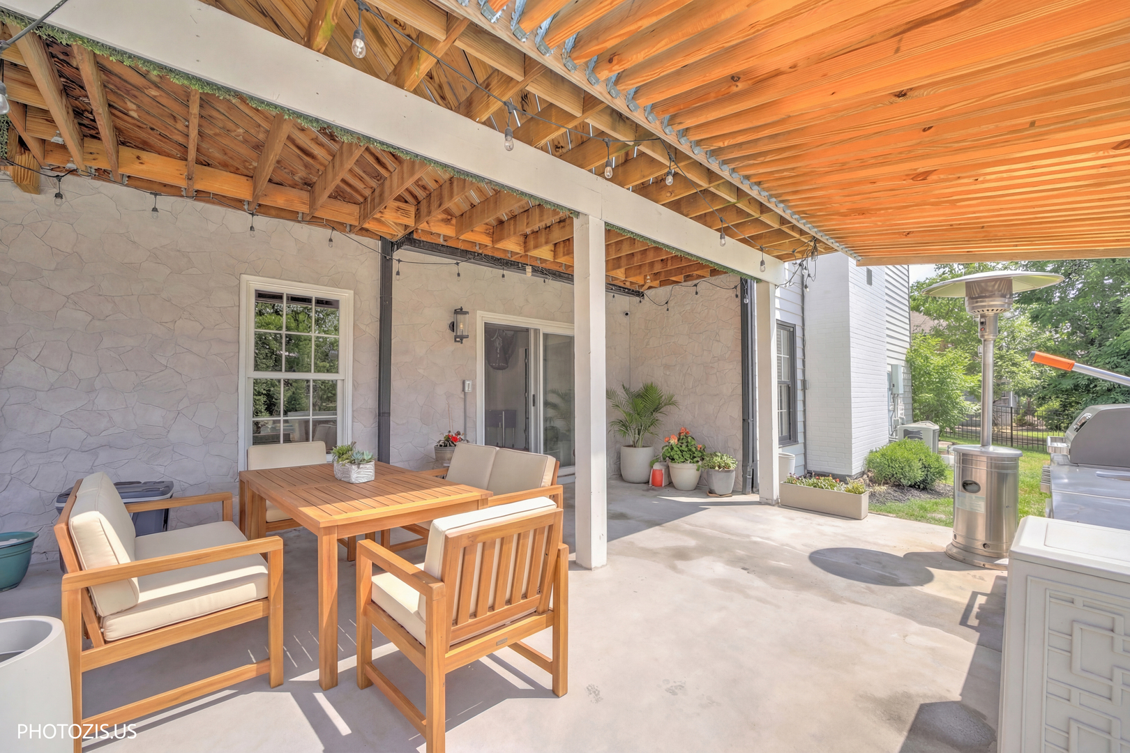 3517 Oakleaf Lane Crystal Lake, IL 60012 - Photo 53 of 76 a outdoor space with patio the couches and a dining table and chairs with wooden floor