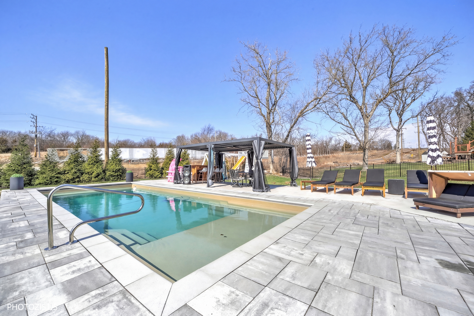 3517 Oakleaf Lane Crystal Lake, IL 60012 - Photo 57 of 76 a view of a swimming pool with a lounge chairs
