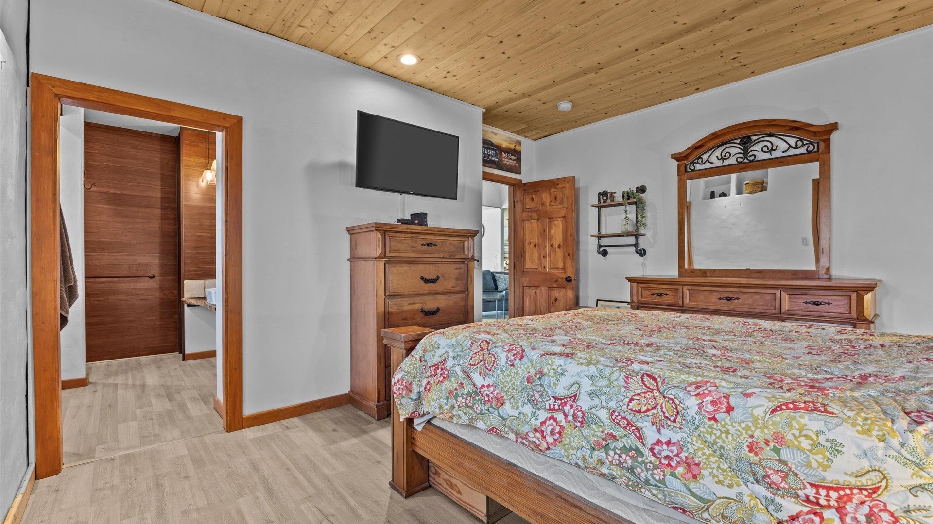 10795 52 52 1/2 Road Molina, CO 81646 - Photo 16 of 41 a bedroom with a bed and a flat screen tv