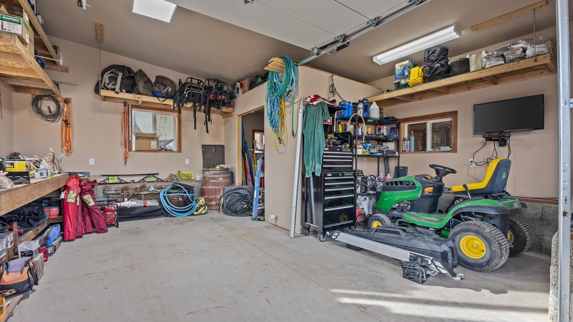 10795 52 52 1/2 Road Molina, CO 81646 - Photo 24 of 41 a view of a garage with stuff