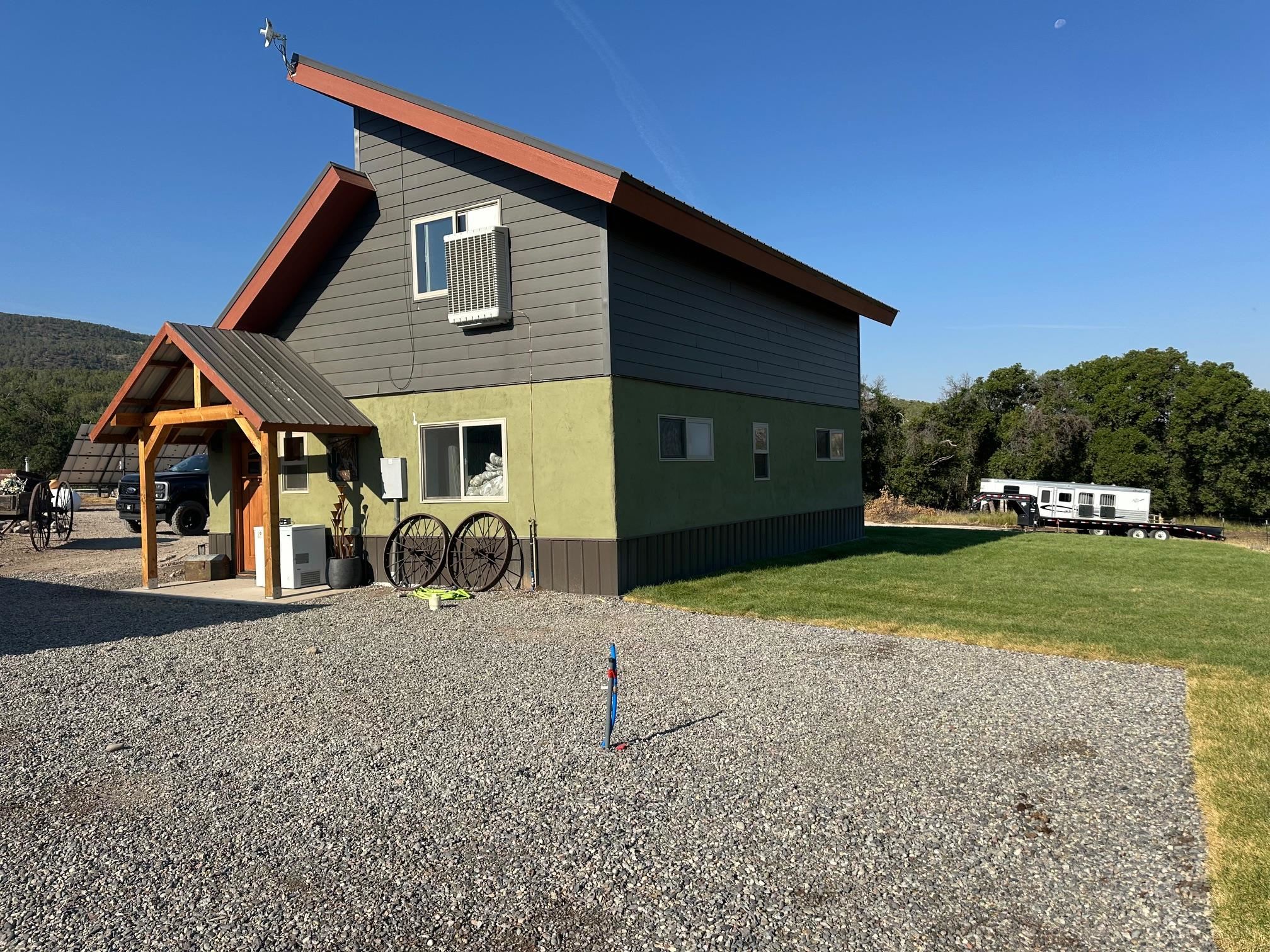 10795 52 52 1/2 Road Molina, CO 81646 - Photo 3 of 41 a house view with a outdoor space