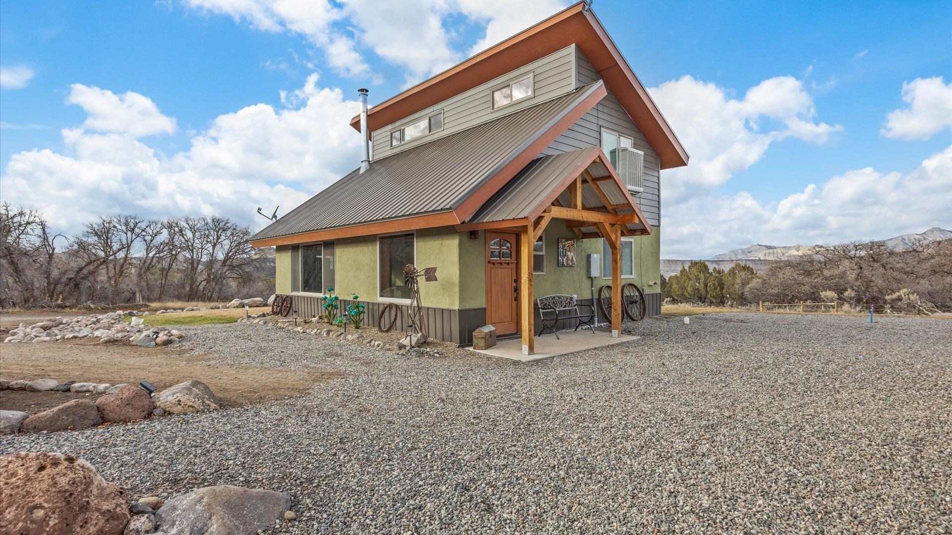 10795 52 52 1/2 Road Molina, CO 81646 - Photo 35 of 41 a view of a house with a yard and sitting area